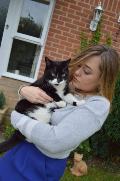 Hannah Gladwin with pet cat Mia, who is a female black and white cat
