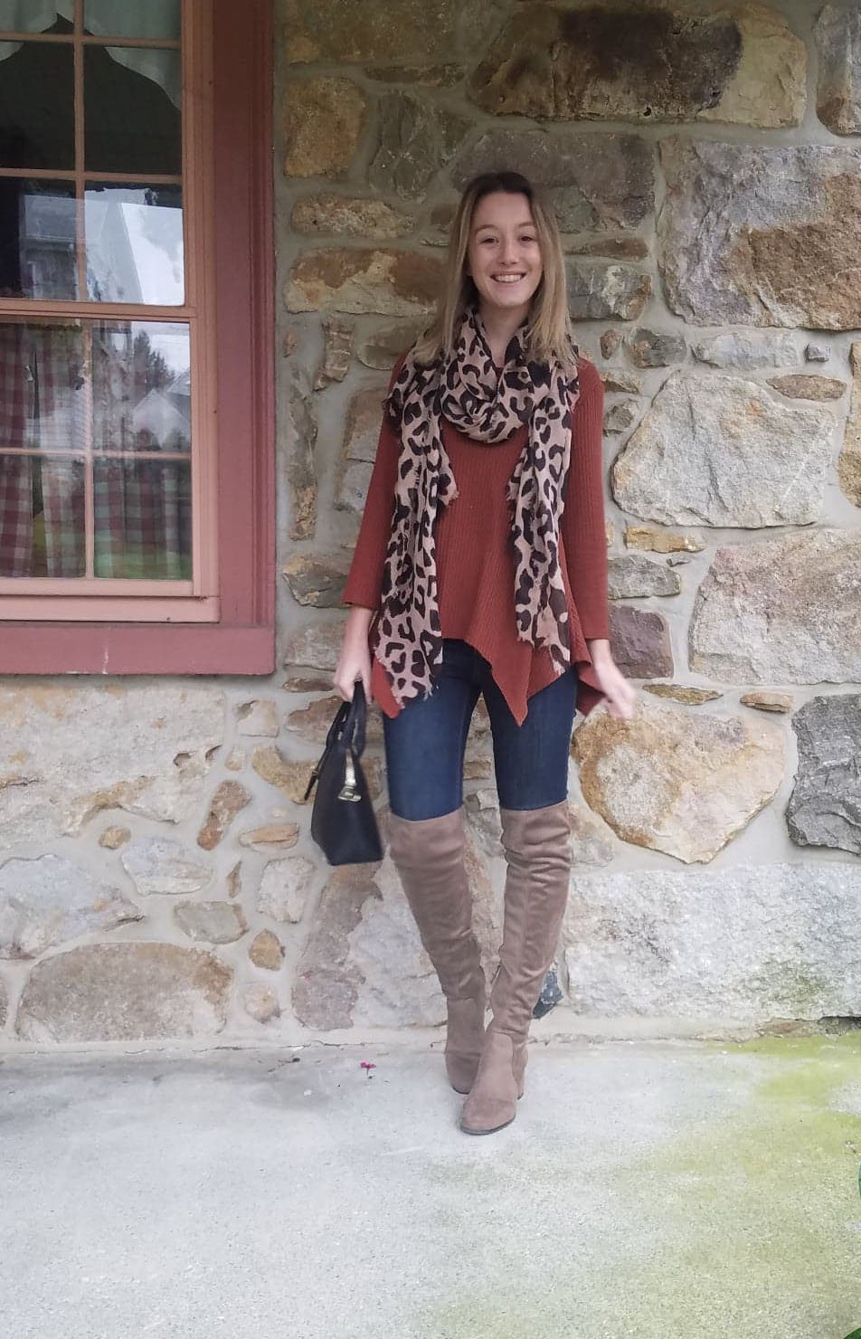 Linsdey Stout Cozy Stylist - wears leopard print scarf, copper coloured sweater and over the knee greige boots
